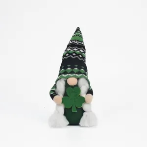 Detail view of St. Patrick's Day gnome doll holding a green Lucky Irish shamrock