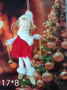 Detail shot of a plush skiing angel doll ornament for Christmas tree decoration