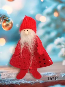 Detailed close-up of a handmade red plush Christmas gnome ornament with white beard