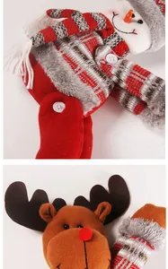 Macro detail of plush Christmas snowman and reindeer dolls for festive curtain decoration