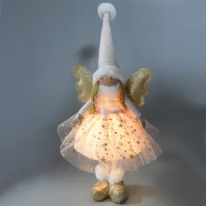 Leuchtende Weihnachtsengel Puppe mit rosa Sternentüllrock und glitzernden Goldflügeln.