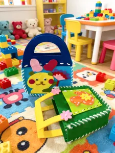 Detailed view of two colorful DIY handmade cartoon felt bags for kids educational crafts