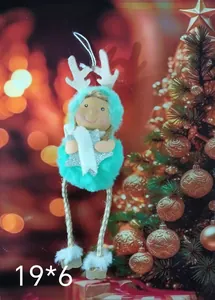 Detailed close-up of teal plush Christmas ornament with reindeer antlers holding a star
