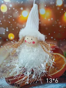 Close-up detail of a white plush angel Christmas tree ornament with dimensions 13x6cm.