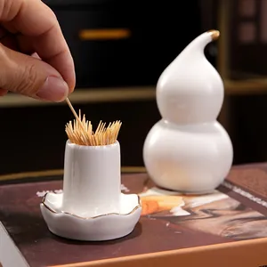 Porte-cure-dents en céramique blanche en forme de gourde avec bordure dorée