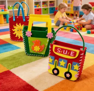 Close-up of colorful vibrant DIY felt craft bags with sun, duck, and bus designs in playroom.