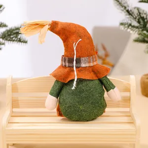 Handmade Thanksgiving harvest faceless gnome doll decoration sitting on a mini wooden bench