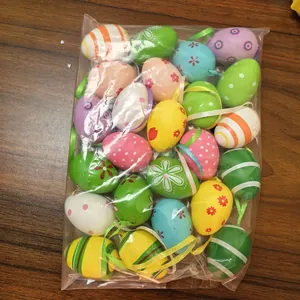 Close-up of colorful 4cm plastic Easter eggs with hanging ribbons in bulk packaging
