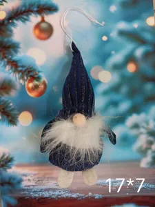 Macro view of a blue striped plush Christmas gnome ornament with dimensions 17 by 7 cm