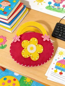 Detailed view of DIY handmade felt bag kit for kids with floral pattern on wooden desk