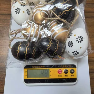 Close-up view of 48g pack containing 6cm black and gold decorative painted Easter eggs