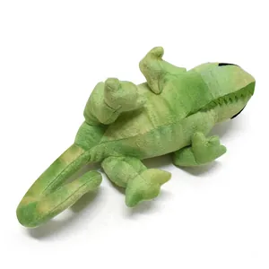 Detail view of a green plush lizard toy with soft fabric texture and realistic features