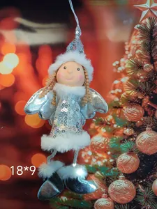 Detailed view of silver sequined Christmas angel plush ornament with white fur trim