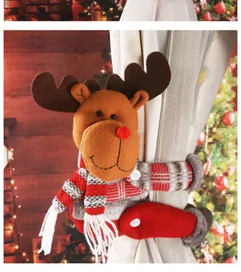 Detailed close-up of a plush reindeer Christmas curtain buckle fastener on a white curtain
