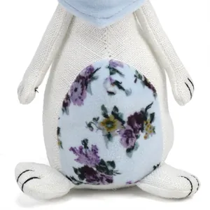 Close-up of linen Easter bunny figurine featuring floral belly pattern and scarf.