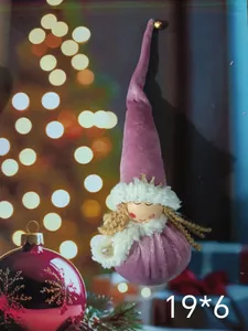 Detail showing a pink plush Christmas angel doll ornament with a long pointed hat.