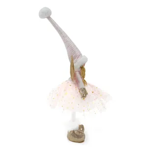 Seitenansicht einer stehenden Weihnachtsengel-Puppe mit rosa Tutu und Goldflügeln.