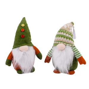 Pair of festive Christmas gnomes with knit hats and white fur beards for holiday decor