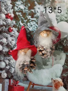 Detailed view of Christmas pinecone gnome ornaments with red and grey felt hats for tree