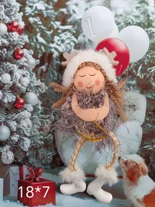 Detail of a Christmas plush angel girl decoration with reindeer antlers in a festive scene.