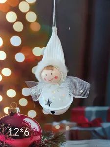 Detail view of a cute white plush angel doll Christmas ornament with 12x6 cm dimensions