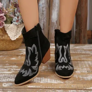 Western-style black suede ankle boots with silver embroidery and wood-look chunky heel
