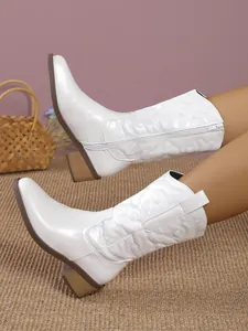 Stylish white mid-calf Western cowboy boots featuring embroidered patterns and a block heel.