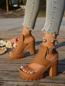 Elegant brown platform block heel sandals with gold buckle strap and toe loop detail