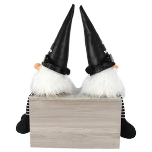 Rock themed Christmas gnomes with black leather hats and sunglasses on wooden box pedestal