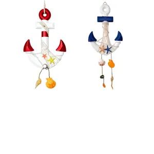 Detailed view of Mediterranean wooden anchor wall hangings with shells and starfish.