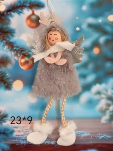 Close-up of plush Christmas angel ornament with reindeer antlers and silver wings