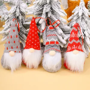 Set of 4 handcrafted knitted Christmas gnome ornaments with red and grey Nordic patterns