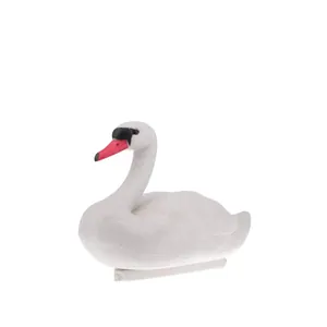 Detailed side view of a realistic white swan garden pond decoration figurine