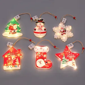 Detailed view of six glowing LED Christmas hanging ornaments in festive shapes