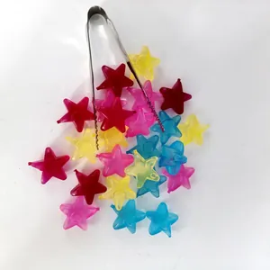 Colorful star-shaped reusable plastic ice cubes with metal tongs for cold party drinks