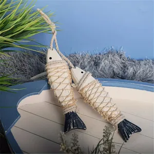 Detail of Mediterranean style hanging wooden fish decor with authentic rope netting