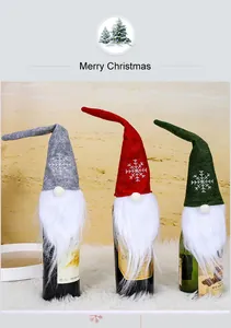 Set of three Christmas gnome wine bottle covers in red, gray, and green