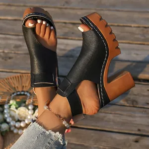 Detailed side view of platform chunky high heel sandals with open toe design