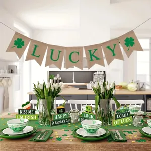 Festive St. Patrick's Day table decor with wooden luck signs and burlap banner