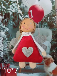 Detailed view of red fabric Christmas angel ornament with silver heart and wings