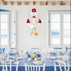 Mediterranean wooden anchor pendant hanging in a nautical themed dining room