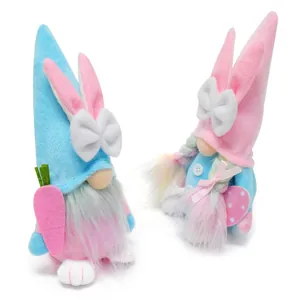 Close-up of cute Easter gnome plush dolls with rabbit ears and colorful carrot decor