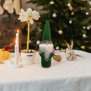 Festive green Christmas gnome wine bottle cover for holiday dining table decor