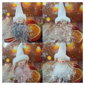 Set of four fuzzy Christmas angel tree ornaments in grey, beige, pink, and white.