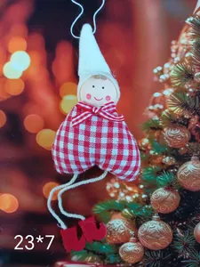 Close-up of red and white checkered fabric heart angel Christmas tree ornament