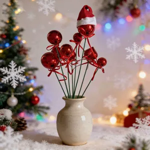 Red glitter Christmas ball picks featuring mini Santa hat in a ceramic vase for decor