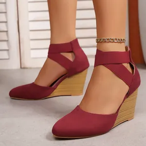 Elegant burgundy suede pointed toe wedge sandals featuring elastic cross ankle straps