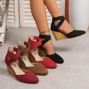 Pointed-toe wedge sandals with elastic ankle straps in black, red, and brown colors.