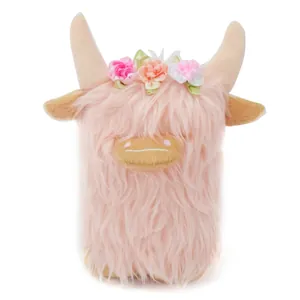 Close-up of pink Highland Cow plush toy with colorful floral headband detail