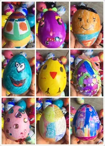 Collection of hand-painted DIY Easter eggs with various cartoon designs and decorations